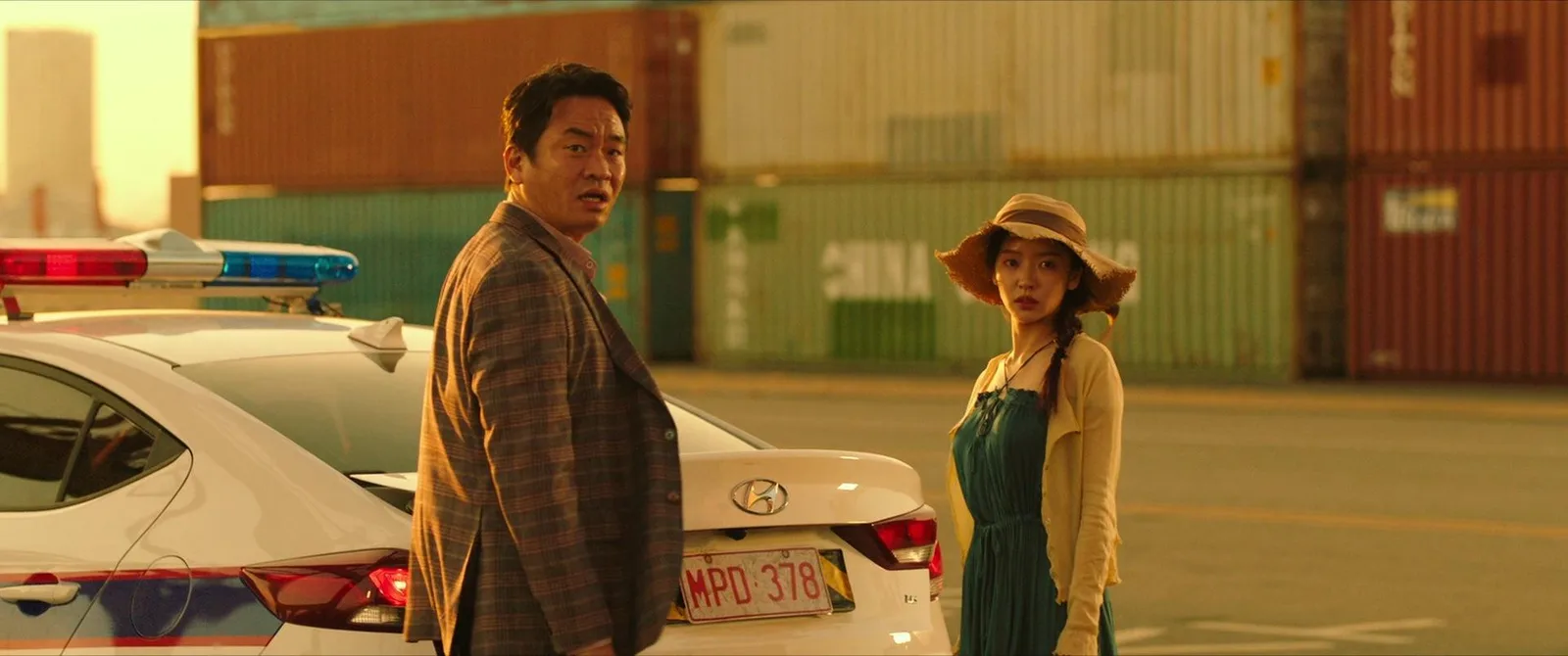 This is a clean two-shot of two characters reacting to an off-screen event, set